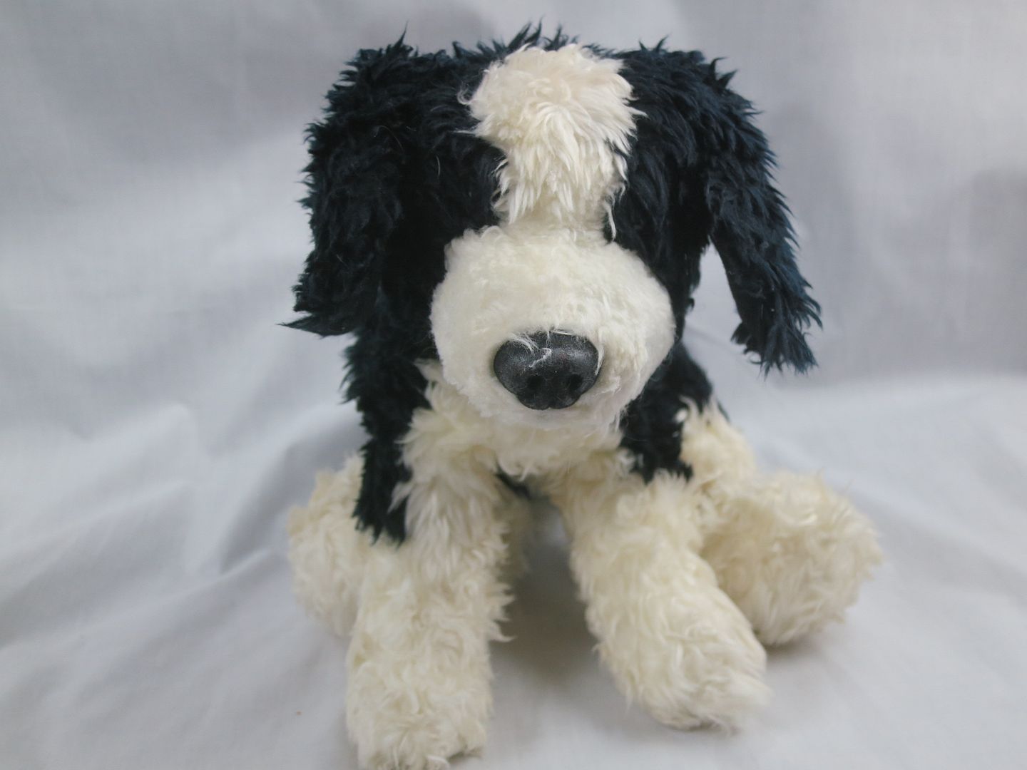 black and white stuffed dog toy